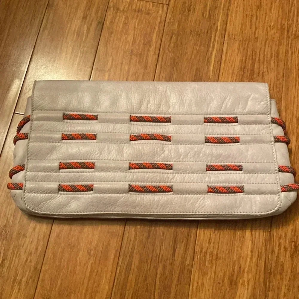 L.A.M.B. By Gwen Stefani gray Leahter clutch -orange rope detail
